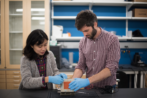 student and faculty member in lab