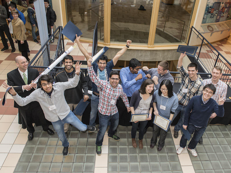 Students celebrate after the annual Graduate Student Research Symposium.