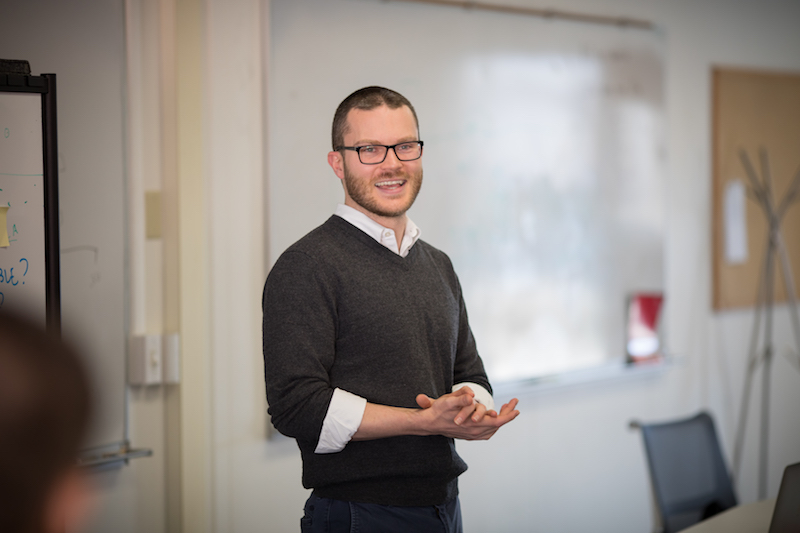 Image of Christopher McComb in a classroom.