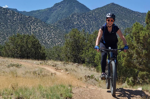 Ophelia Bolmin riding bike in mountains