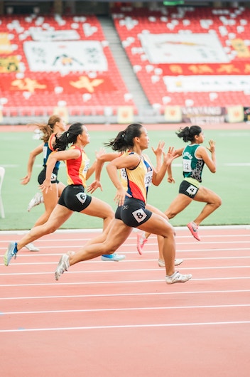 People running a race around a track